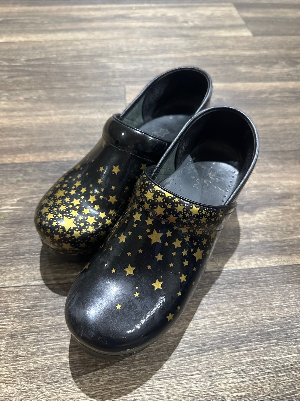 Dansko Black Falling Gold Star Clogs